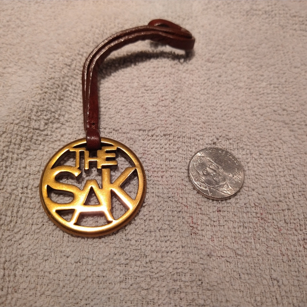 The Sak Gold Tone Metal Keychain Bag Purse Charm